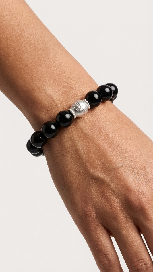 Orbii Obsidian Silver Edition bracelet NFC charm detail - crystal jewelry for courage and protection
